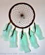 Dreamcatcher with jade-green feathers