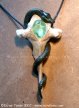 Bone pendant with gem and snake